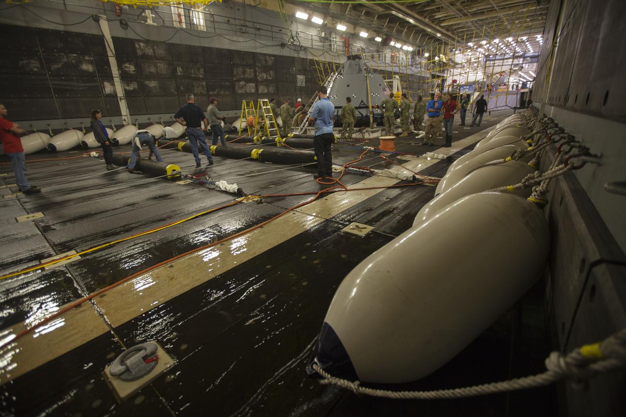 A test version of the Orion crew module is secured in the well deck of the USS San Diego and recovery team members are preparing for Underway Recovery Test 5 in the Pacific Ocean off the coast of California. NASA's Ground Systems Development and Operations Program and the U.S. Navy will conduct a series of tests using the ship's well deck, the test module, various watercraft and equipment to prepare for recovery of Orion on its return from deep space missions. The test will allow the team to demonstrate and evaluate recovery processes, procedures, hardware and personnel in open waters. Orion is the exploration spacecraft designed to carry astronauts to destinations not yet explored by humans, including an asteroid and NASA's Journey to Mars. It will have emergency abort capability, sustain the crew during space travel and provide safe re-entry from deep space return velocities. Orion is scheduled to launch on NASA's Space Launch System in late 2018. For more information, visit http://www.nasa.gov/orion. 