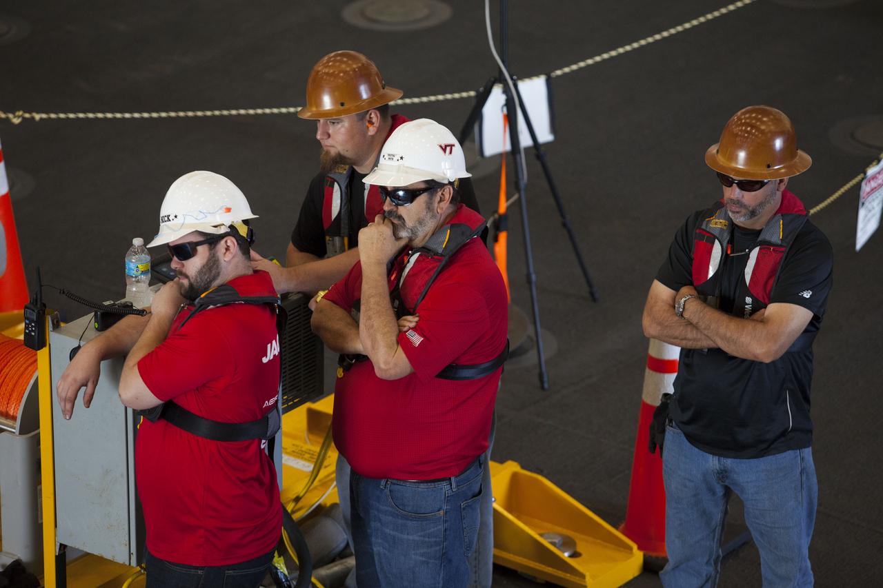 Members of the recovery team watch as a test version of the Orion crew module is secured in the flooded well deck of the USS San Diego during Underway Recovery Test 5 in the Pacific Ocean off the coast of California. NASA's Ground Systems Development and Operations Program and the U.S. Navy are conducting a series of tests to prepare for recovery of Orion on its return from deep space missions. The testing will allow the team to demonstrate and evaluate recovery processes, procedures, hardware and personnel in open waters. Orion is the exploration spacecraft designed to carry astronauts to destinations not yet explored by humans, including an asteroid and NASA's Journey to Mars. It will have emergency abort capability, sustain the crew during space travel and provide safe re-entry from deep space return velocities. Orion is scheduled to launch on NASA's Space Launch System in late 2018. For more information, visit http://www.nasa.gov/orion.