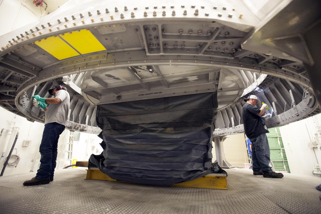 Technicians with Orbital ATK, prime contractor for the Space Launch System (SLS) Booster, prepare the right hand aft skirt for NASA’s SLS rocket for primer and painting inside a support building at the Hangar AF facility at Cape Canaveral Air Force Station in Florida. The space shuttle-era aft skirt, was inspected and resurfaced and will be primed and painted for use on the right hand booster of the SLS rocket for Exploration Mission 1 (EM-1). NASA is preparing for EM-1, deep-space missions, and the journey to Mars. 