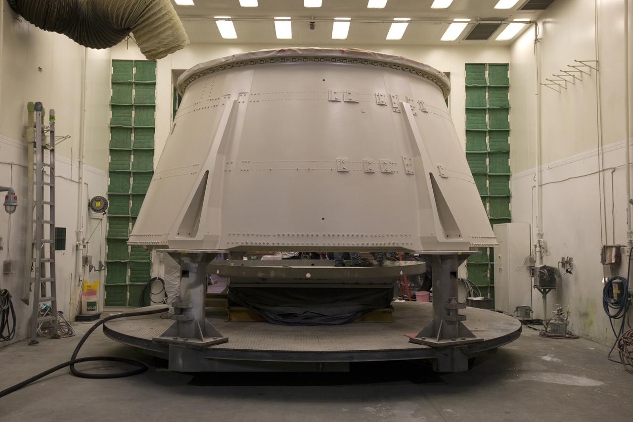 The right hand aft skirt for NASA's Space Launch System (SLS) rocket has been painted and is in a drying cell in a support building at the Hangar AF facility at Cape Canaveral Air Force Station in Florida. The space shuttle-era aft skirt will be used on the right hand booster of NASA's Space Launch System rocket for Exploration Mission 1 (EM-1). NASA is preparing for EM-1, deep space missions, and the Journey to Mars. 