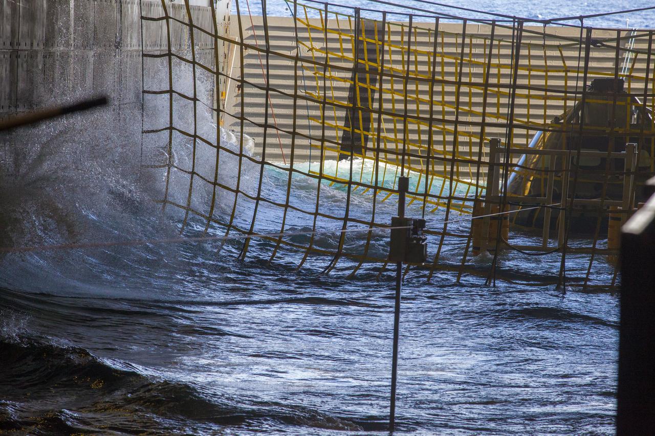 A test version of the Orion crew module, in view at far right, is in the flooded well deck of the USS San Diego during Underway Recovery Test 5 in the Pacific Ocean off the coast of California. NASA's Ground Systems Development and Operations Program and the U.S. Navy are conducting a series of tests to prepare for recovery of Orion on its return from deep space missions. The testing will allow the team to demonstrate and evaluate recovery processes, procedures, hardware and personnel in open waters. Orion is the exploration spacecraft designed to carry astronauts to destinations not yet explored by humans, including an asteroid and NASA's Journey to Mars. It will have emergency abort capability, sustain the crew during space travel and provide safe re-entry from deep space return velocities. Orion is scheduled to launch on NASA's Space Launch System in late 2018. For more information, visit http://www.nasa.gov/orion. 