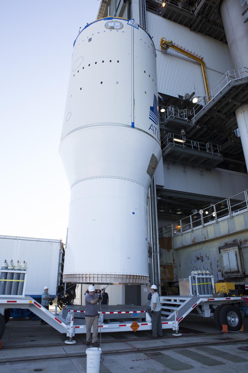 United Launch Alliance team members assist as operation begin to lift the Atlas V Centaur second stage into the Vertical Integration Facility at Space Launch Complex 41 at Cape Canaveral Air Force Station in Florida. The Geostationary Operational Environmental Satellite (GOES-R) will launch aboard the Atlas V rocket in November. GOES-R is the first satellite in a series of next-generation NOAA GOES Satellites.