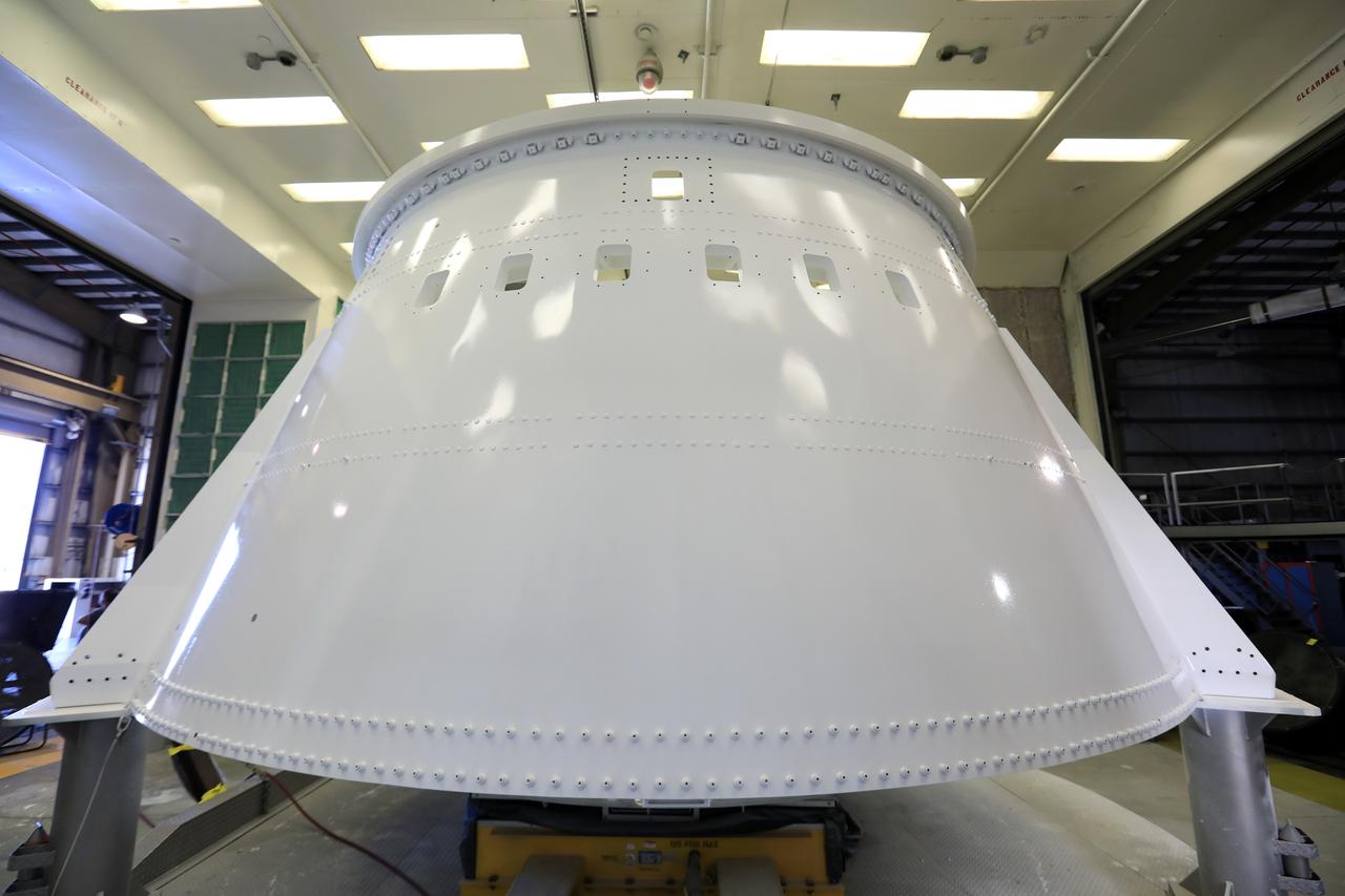 The right hand aft skirt for NASA's Space Launch System (SLS) rocket has been refurbished and painted and is in a drying cell in a support building at the Hangar AF facility at Cape Canaveral Air Force Station in Florida. The space shuttle-era aft skirt will be used on the right hand booster of the SLS for Exploration Mission 1 (EM-1). NASA is preparing for EM-1, deep space missions, and the Journey to Mars. 