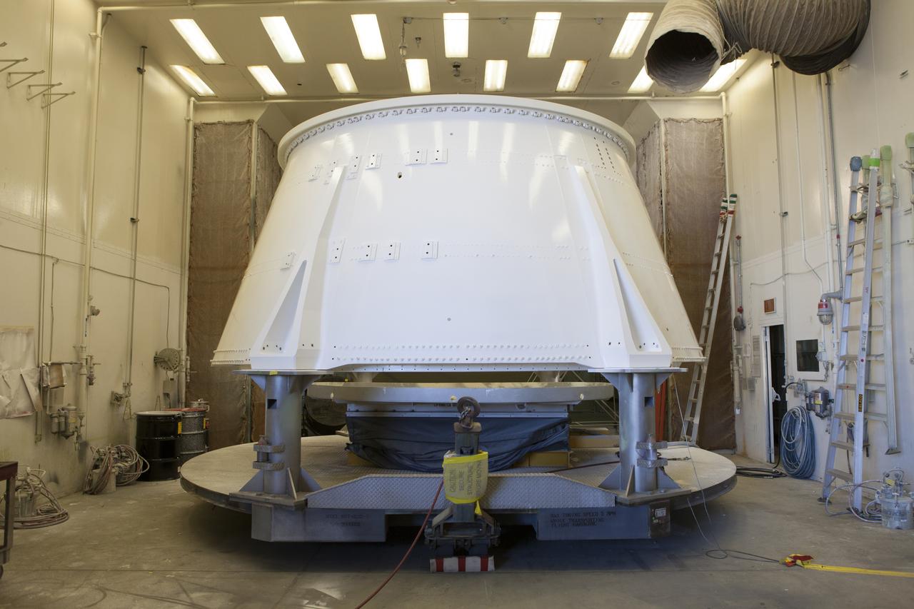 The right hand aft skirt for NASA's Space Launch System (SLS) rocket has been refurbished and painted and is in a drying cell in a support building at the Hangar AF facility at Cape Canaveral Air Force Station in Florida. The space shuttle-era aft skirt will be used on the right hand booster of the SLS for Exploration Mission 1 (EM-1). NASA is preparing for EM-1, deep space missions, and the Journey to Mars. 
