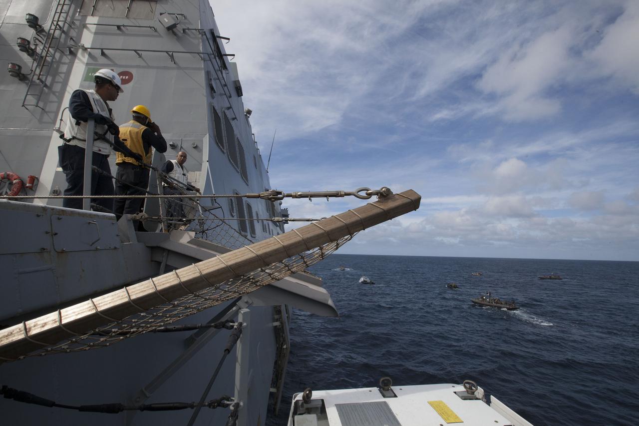 Recovery team members watch Underway Recovery Test 5 from the deck of the USS San Diego in the Pacific Ocean off the coast of California. NASA's Ground Systems Development and Operations Program and the U.S. Navy are using a test version of the Orion crew module, several rigid hull inflatable boats and support equipment to prepare to prepare for recovery of Orion on its return from deep space missions. The testing will allow the team to demonstrate and evaluate recovery processes, procedures, hardware and personnel in open waters. Orion is the exploration spacecraft designed to carry astronauts to destinations not yet explored by humans, including an asteroid and NASA's Journey to Mars. It will have emergency abort capability, sustain the crew during space travel and provide safe re-entry from deep space return velocities. Orion is scheduled to launch on NASA's Space Launch System in late 2018. For more information, visit http://www.nasa.gov/orion.