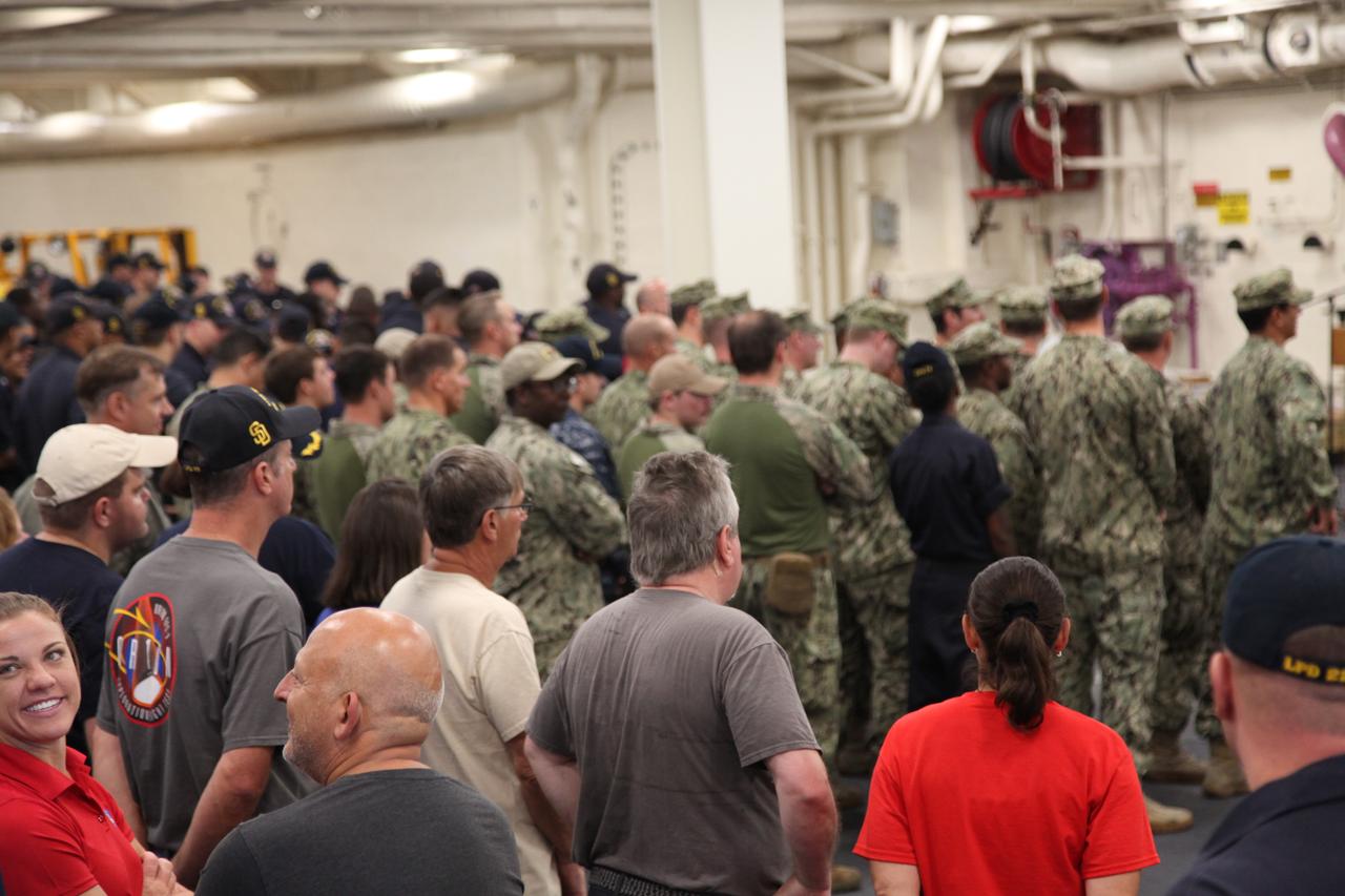 Orion Underway Recovery Test 5 team members gather in the USS San Diego at the end of a series of tests. NASA's Ground Systems Development and Operations Program and the U.S. Navy practiced recovery techniques in the Pacific Ocean off the coast of California over several days, using the well deck of the ship and a test version of the Orion crew module to prepare for recovery of Orion on its return from deep space missions. The testing allowed the team to demonstrate and evaluate recovery processes, procedures, hardware and personnel in open waters. Orion is the exploration spacecraft designed to carry astronauts to destinations not yet explored by humans, including an asteroid and NASA's Journey to Mars. It will have emergency abort capability, sustain the crew during space travel and provide safe re-entry from deep space return velocities. Orion is scheduled to launch on NASA's Space Launch System in late 2018. For more information, visit http://www.nasa.gov/orion.