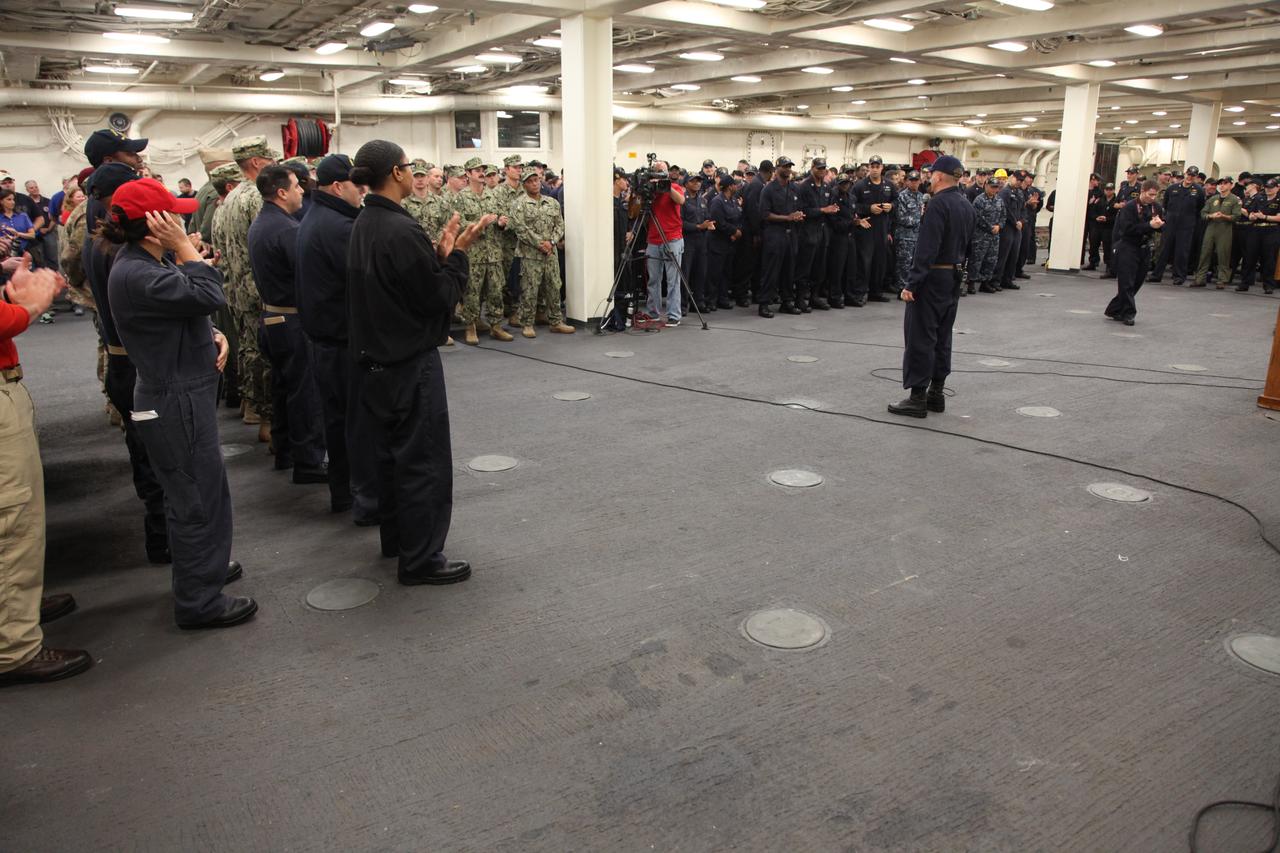 Orion Underway Recovery Test 5 team members gather in the USS San Diego during wrap up of the series of tests. NASA's Ground Systems Development and Operations Program and the U.S. Navy practiced recovery techniques in the Pacific Ocean off the coast of California over several days, using the well deck of the ship and a test version of the Orion crew module to prepare for recovery of Orion on its return from deep space missions. The testing allowed the team to demonstrate and evaluate recovery processes, procedures, hardware and personnel in open waters. Orion is the exploration spacecraft designed to carry astronauts to destinations not yet explored by humans, including an asteroid and NASA's Journey to Mars. It will have emergency abort capability, sustain the crew during space travel and provide safe re-entry from deep space return velocities. Orion is scheduled to launch on NASA's Space Launch System in late 2018. For more information, visit http://www.nasa.gov/orion. 