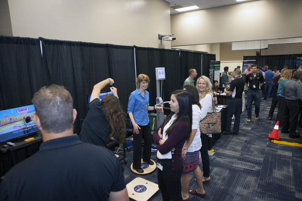 Visitors stop by a NASA booth in the Space Station Processing Facility conference center at NASA's Kennedy Space Center during the 2016 Innovation Expo. Now in its fifth year, the purpose of the Innovation Expo is to help foster innovation and creativity among Kennedy employees who are encouraged to look for ways to do their work better and to propose concepts for tackling future mission needs.
