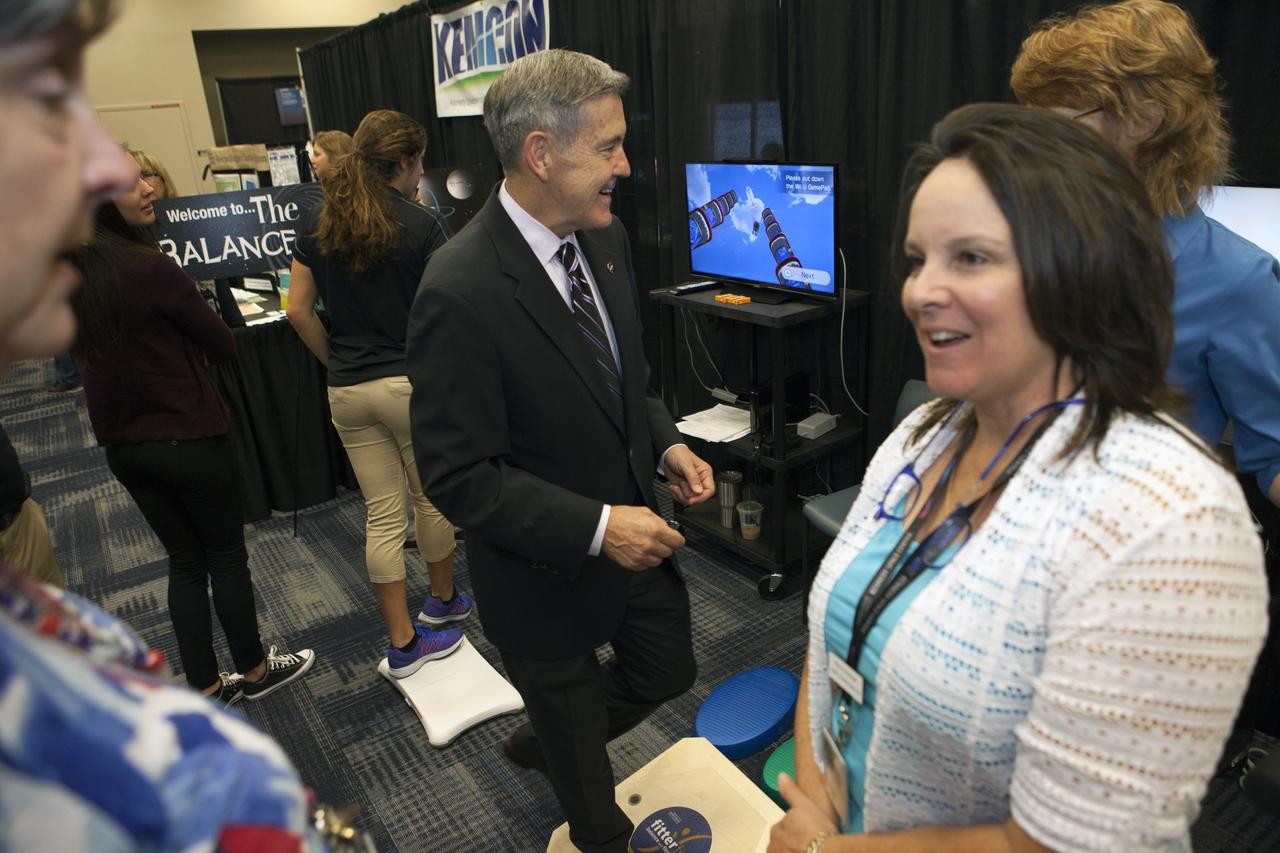 Kennedy Space Center Director Bob Cabana stops by a NASA booth in the Space Station Processing Facility conference center during the 2016 Innovation Expo. Now in its fifth year, the purpose of the Innovation Expo is to help foster innovation and creativity among Kennedy employees who are encouraged to look for ways to do their work better and to propose concepts for tackling future mission needs.