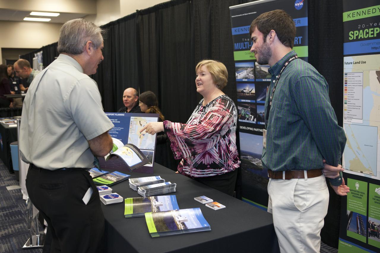 Visitors stop by a NASA booth in the Space Station Processing Facility conference center at NASA's Kennedy Space Center during the 2016 Innovation Expo. Now in its fifth year, the purpose of the Innovation Expo is to help foster innovation and creativity among Kennedy employees who are encouraged to look for ways to do their work better and to propose concepts for tackling future mission needs.