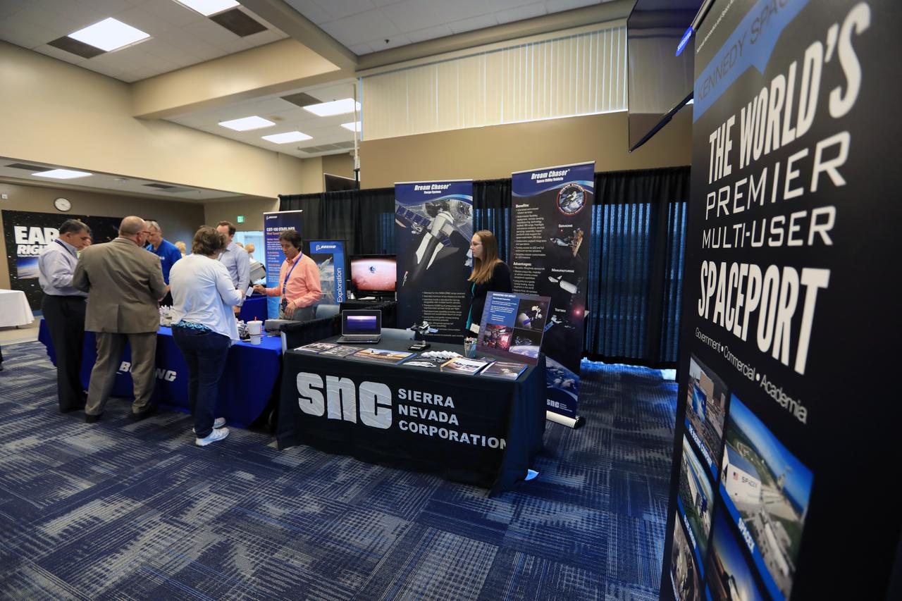 Visitors stop by a NASA booth in the Space Station Processing Facility conference center at NASA's Kennedy Space Center during the 2016 Innovation Expo. Now in its fifth year, the purpose of the Innovation Expo is to help foster innovation and creativity among Kennedy employees who are encouraged to look for ways to do their work better and to propose concepts for tackling future mission needs.