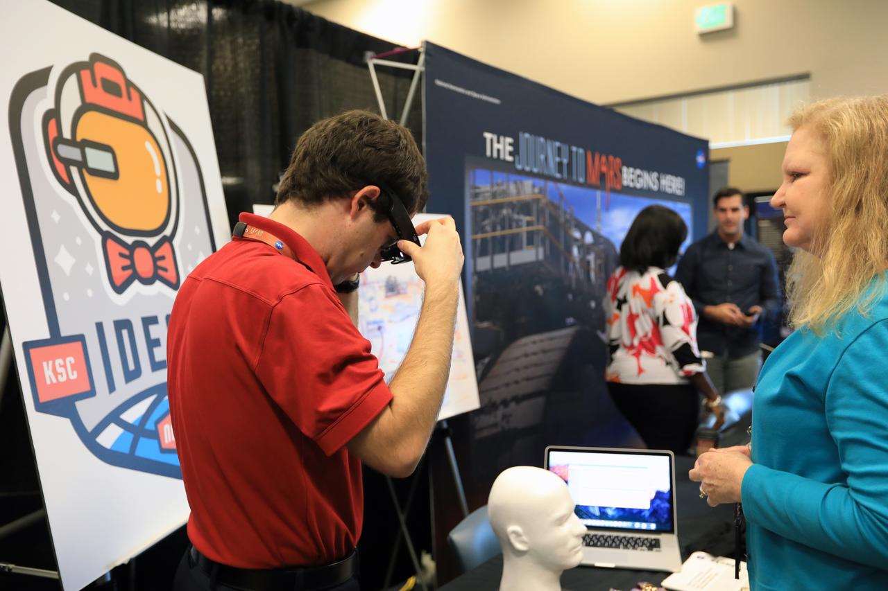 Kennedy Space Center Director Bob Cabana stops by a NASA booth in the Space Station Processing Facility conference center during the 2016 Innovation Expo. Now in its fifth year, the purpose of the Innovation Expo is to help foster innovation and creativity among Kennedy employees who are encouraged to look for ways to do their work better and to propose concepts for tackling future mission needs.