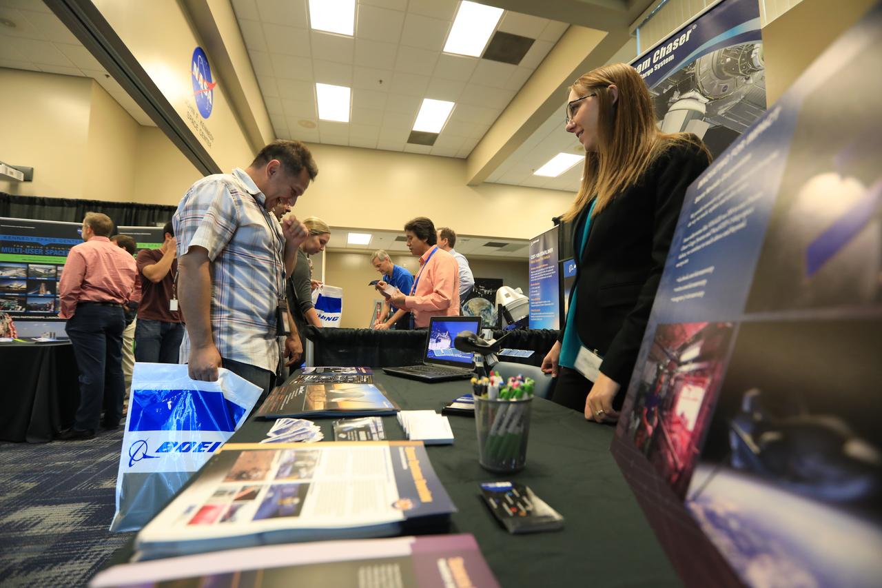 Kennedy Space Center Director Bob Cabana stops by a NASA booth in the Space Station Processing Facility conference center during the 2016 Innovation Expo. Now in its fifth year, the purpose of the Innovation Expo is to help foster innovation and creativity among Kennedy employees who are encouraged to look for ways to do their work better and to propose concepts for tackling future mission needs.