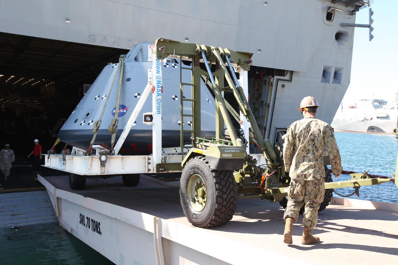The USS San Diego is docked at Naval Base San Diego in California after returning from Underway Recovery Test 5 in the Pacific Ocean. A test version of the Orion crew module is being offloaded from the well deck of the ship. NASA's Ground Systems Development and Operations Program and the U.S. Navy completed a series of tests using the ship's well deck, the test module, various watercraft and equipment to prepare for recovery of Orion on its return from deep space missions. The testing allowed the team to demonstrate and evaluate recovery processes, procedures, hardware and personnel in open waters. Orion is the exploration spacecraft designed to carry astronauts to destinations not yet explored by humans, including an asteroid and NASA's Journey to Mars. It will have emergency abort capability, sustain the crew during space travel and provide safe re-entry from deep space return velocities. Orion is scheduled to launch on NASA's Space Launch System in late 2018. For more information, visit http://www.nasa.gov/orion.