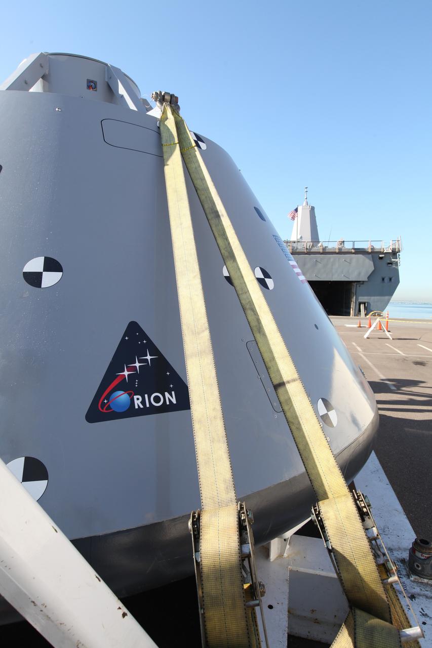 The USS San Diego is docked at Naval Base San Diego in California after returning from Underway Recovery Test 5 in the Pacific Ocean. A test version of the Orion crew module, secured on its handling fixture, was offloaded from the well deck of the ship. NASA's Ground Systems Development and Operations Program and the U.S. Navy completed a series of tests using the ship's well deck, the test module, various watercraft and equipment to prepare for recovery of Orion on its return from deep space missions. The testing allowed the team to demonstrate and evaluate recovery processes, procedures, hardware and personnel in open waters. Orion is the exploration spacecraft designed to carry astronauts to destinations not yet explored by humans, including an asteroid and NASA's Journey to Mars. It will have emergency abort capability, sustain the crew during space travel and provide safe re-entry from deep space return velocities. Orion is scheduled to launch on NASA's Space Launch System in late 2018. For more information, visit http://www.nasa.gov/orion.
