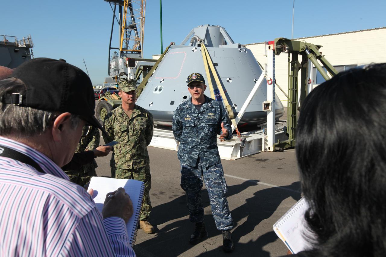 U.S. Navy recovery team members speak to members of the media about Orion Underway Recovery Test 5. The USS San Diego is docked at Naval Base San Diego in California and the test version of the Orion crew module, secured on its handling fixture, was offloaded from the well deck of the ship. NASA's GSDO Program and the U.S. Navy completed a series of tests using the ship's well deck, the test module, various watercraft and equipment to prepare for recovery of Orion on its return from deep space missions. The testing allowed the team to demonstrate and evaluate recovery processes, procedures, hardware and personnel in open waters. Orion is the exploration spacecraft designed to carry astronauts to destinations not yet explored by humans, including an asteroid and NASA's Journey to Mars. It will have emergency abort capability, sustain the crew during space travel and provide safe re-entry from deep space return velocities. Orion is scheduled to launch on NASA's Space Launch System in late 2018. For more information, visit http://www.nasa.gov/orion.