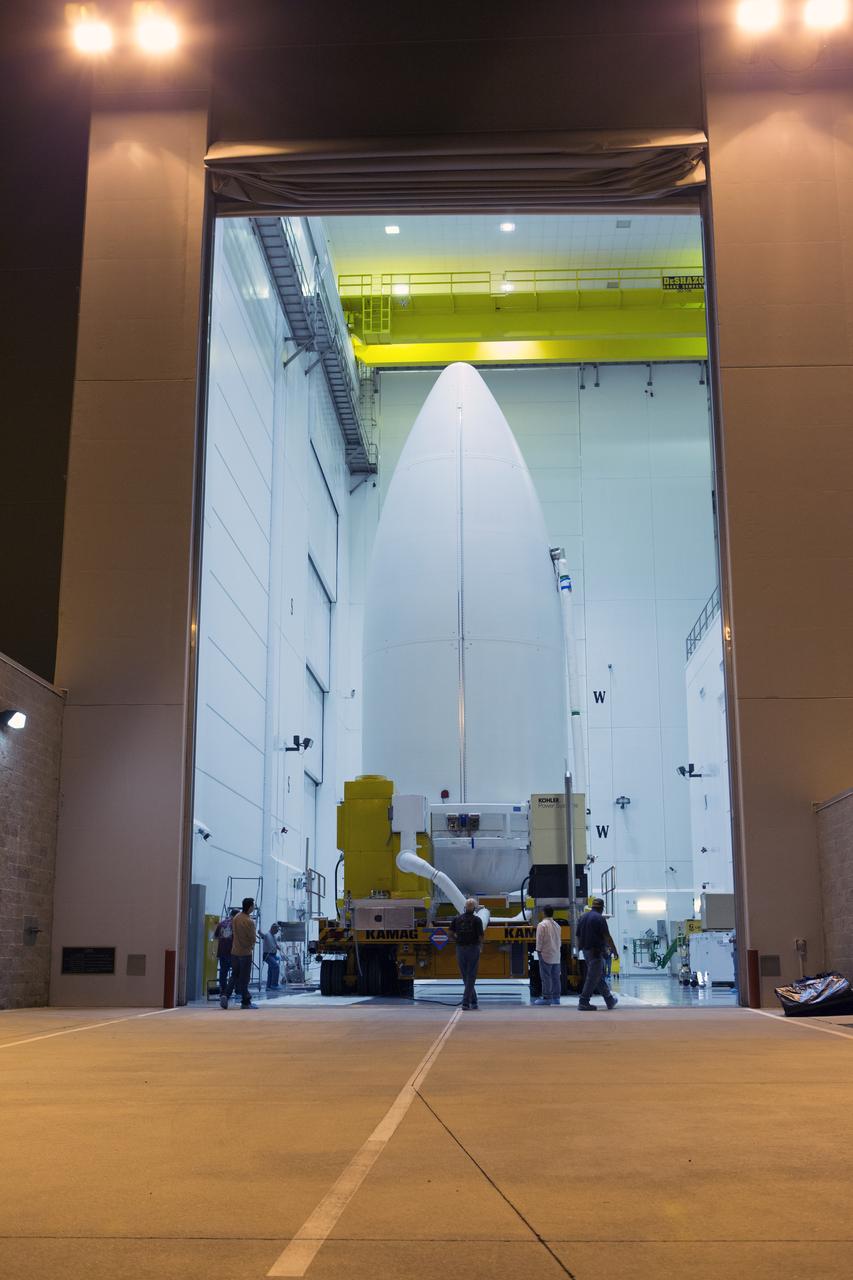 Enclosed in its payload fairing, NOAA's Geostationary Operational Environmental Satellite (GOES-R) is moved out of the Astrotech payload processing facility in Titusville, Florida, near NASA's Kennedy Space Center. GOES-R will be transported to the Vertical Integration Facility at Space Launch Complex 41 at Cape Canaveral Air Force Station. The satellite will launch aboard a United Launch Alliance Atlas V rocket in November. GOES-R is the first satellite in a series of next-generation NOAA GOES Satellites. 