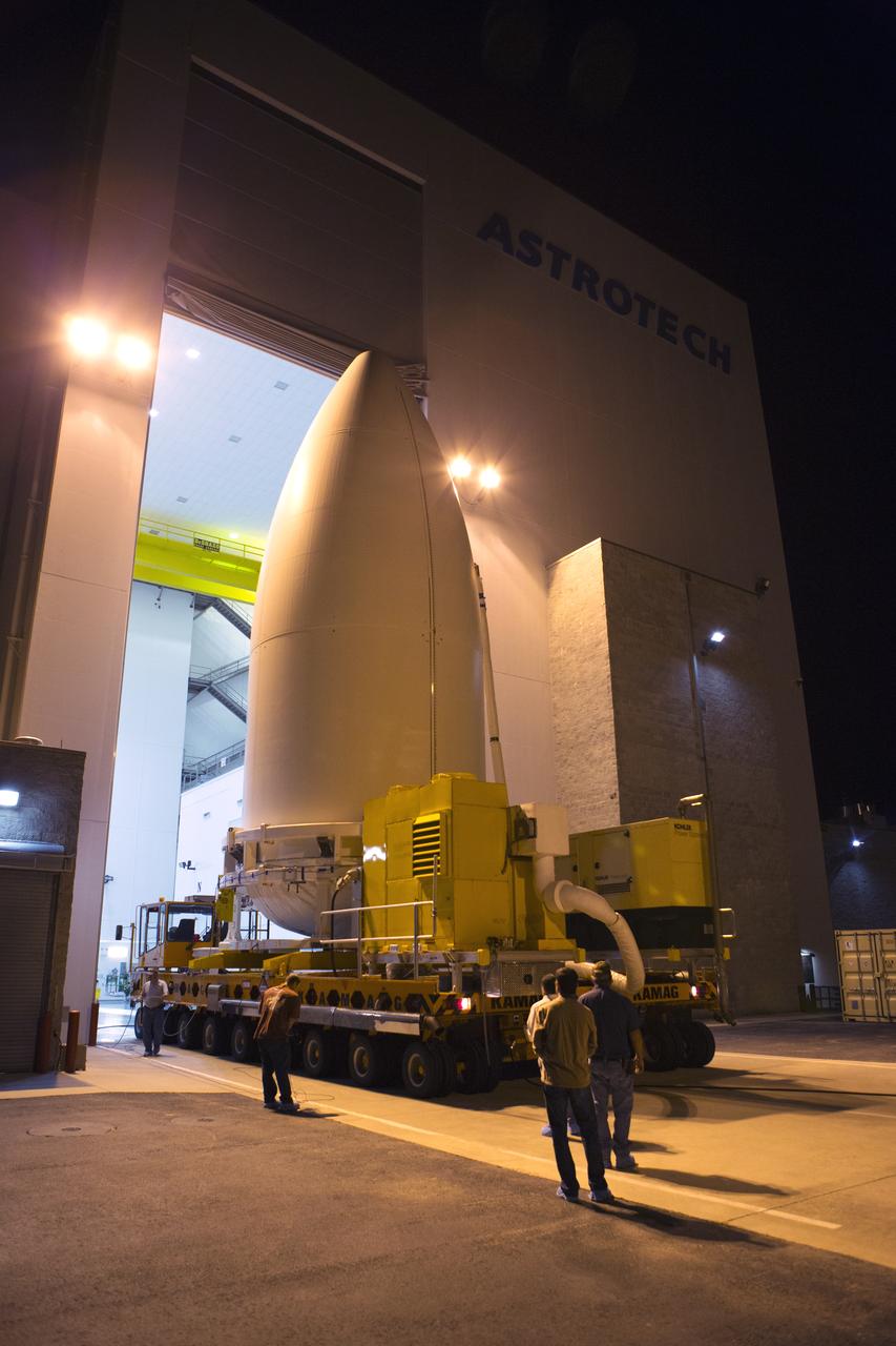 Enclosed in its payload fairing, NOAA's Geostationary Operational Environmental Satellite (GOES-R) emerges from the Astrotech payload processing facility in Titusville, Florida, near NASA's Kennedy Space Center. GOES-R will be transported to the Vertical Integration Facility at Space Launch Complex 41 at Cape Canaveral Air Force Station. The satellite will launch aboard a United Launch Alliance Atlas V rocket in November. GOES-R is the first satellite in a series of next-generation NOAA GOES Satellites.