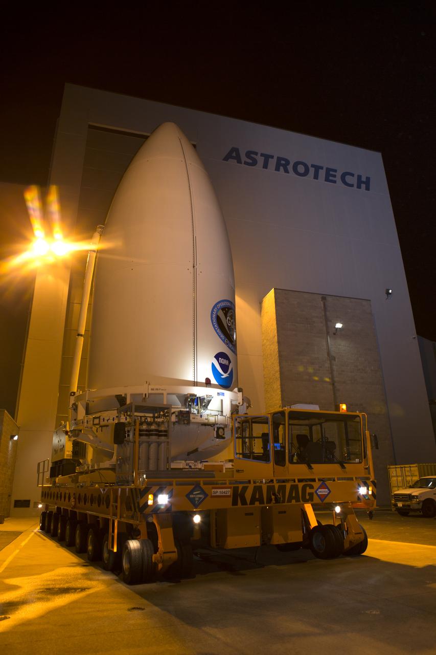 Enclosed in its payload fairing, NOAA's Geostationary Operational Environmental Satellite (GOES-R) departs from the Astrotech payload processing facility in Titusville, Florida, near NASA's Kennedy Space Center. GOES-R will be transported to the Vertical Integration Facility at Space Launch Complex 41 at Cape Canaveral Air Force Station. The satellite will launch aboard a United Launch Alliance Atlas V rocket in November. GOES-R is the first satellite in a series of next-generation NOAA GOES Satellites. 