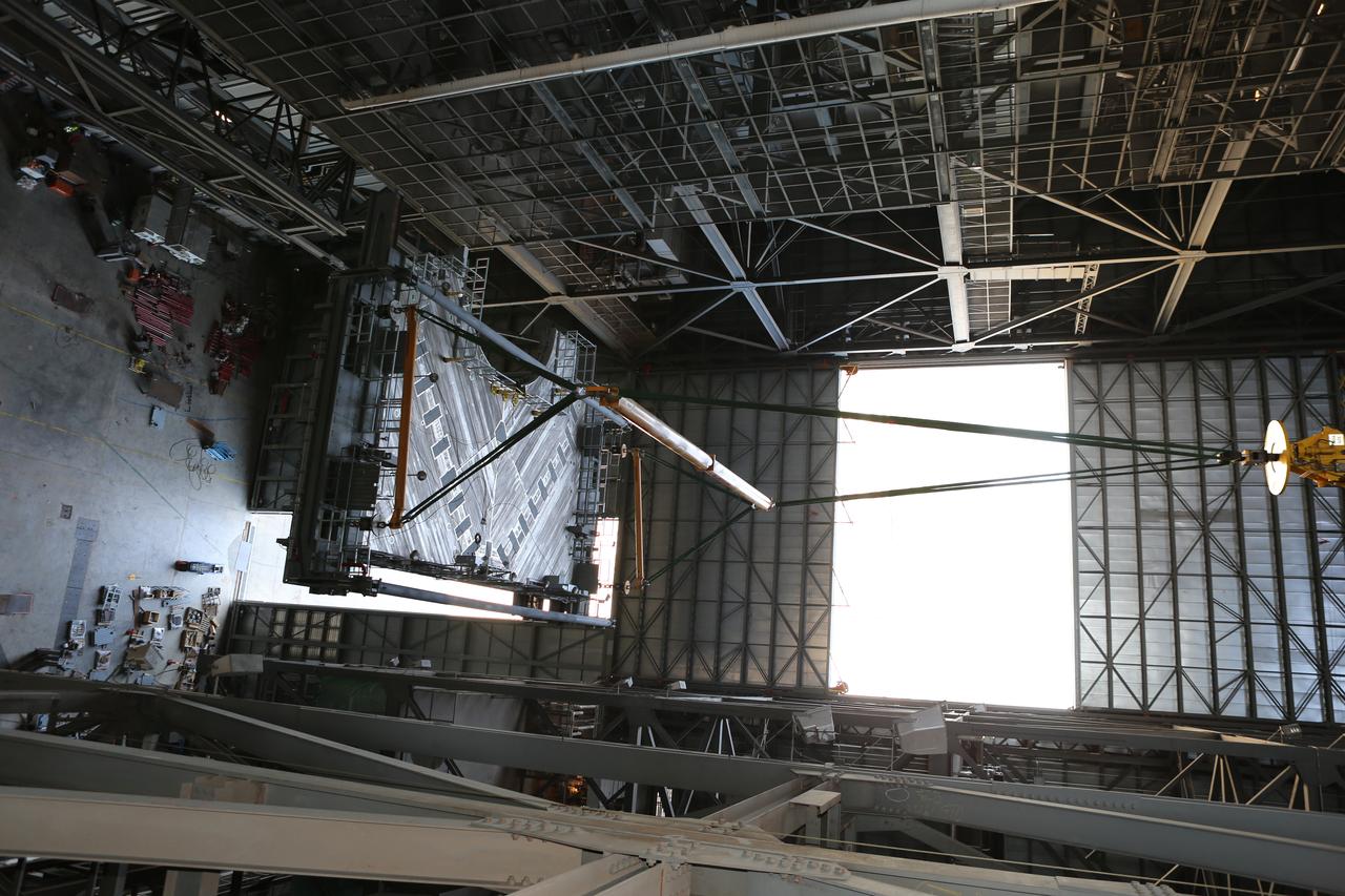 A heavy-lift crane lifts the second half of the C-level work platforms, C north, for NASA’s Space Launch System (SLS) rocket, up from the transfer aisle floor of the Vehicle Assembly Building (VAB) at NASA’s Kennedy Space Center in Florida. The C platform will be installed on the north side of High Bay 3. The C platforms are the eighth of 10 levels of work platforms that will surround and provide access to the SLS rocket and Orion spacecraft for Exploration Mission 1. The Ground Systems Development and Operations Program is overseeing upgrades and modifications to VAB High Bay 3, including installation of the new work platforms, to prepare for NASA’s Journey to Mars. 