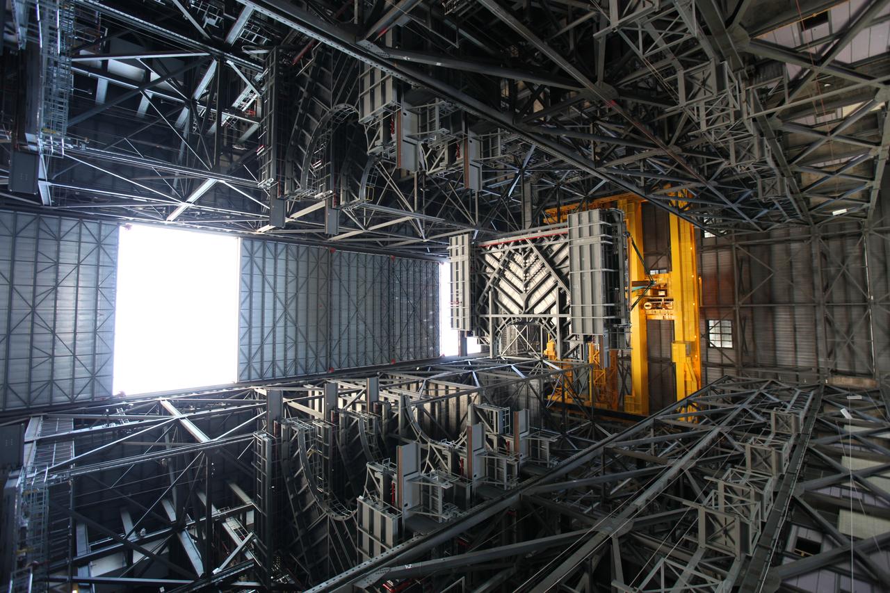 A heavy-lift crane lowers the second half of the C-level work platforms, C north, for NASA’s Space Launch System (SLS) rocket, into High Bay 3 of the Vehicle Assembly Building (VAB) at NASA's Kennedy Space Center in Florida. The C platform will be installed on the north side of High Bay 3. In view below are several of the previously installed levels of platforms. The C platforms are the eighth of 10 levels of work platforms that will surround and provide access to the SLS rocket and Orion spacecraft for Exploration Mission 1. The Ground Systems Development and Operations Program is overseeing upgrades and modifications to VAB High Bay 3, including installation of the new work platforms, to prepare for NASA’s Journey to Mars.