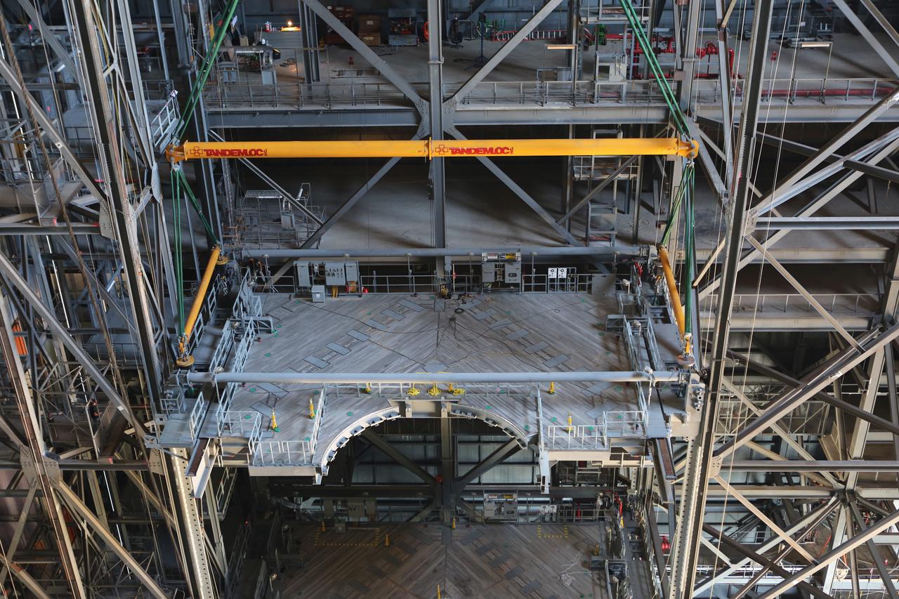 Inside the Vehicle Assembly Building at NASA’s Kennedy Space Center in Florida, the second half of the C-level work platforms, C north, for NASA’s Space Launch System (SLS) rocket, is lowered into position for installation on the north side of High Bay 3. The C platforms are the eighth of 10 levels of work platforms that will surround and provide access to the SLS rocket and Orion spacecraft for Exploration Mission 1. The Ground Systems Development and Operations Program is overseeing upgrades and modifications to VAB High Bay 3, including installation of the new work platforms, to prepare for NASA’s Journey to Mars.