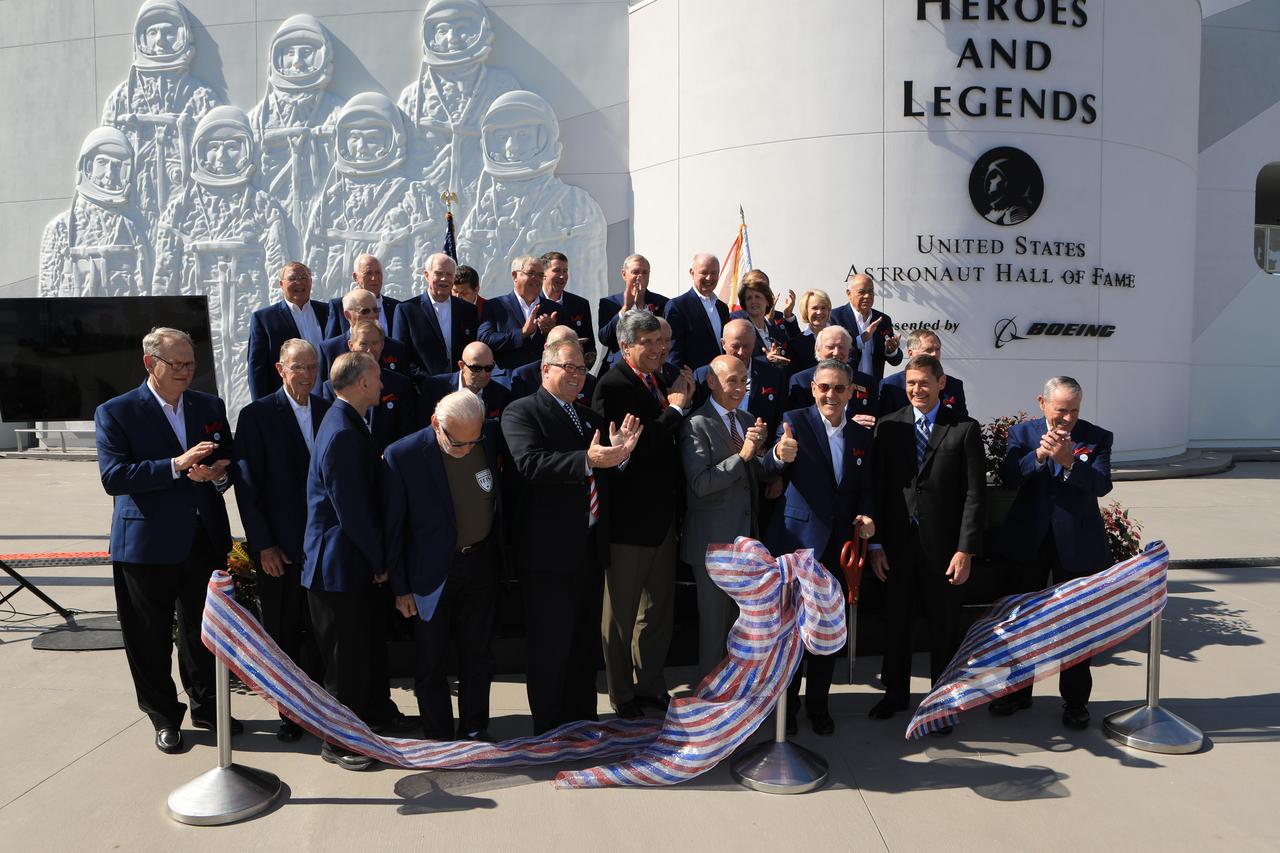 Dignitaries, including members of the U.S. Astronaut Hall of Fame, have just cut a ceremonial ribbon opening the Heroes and Legends attraction at the Kennedy Space Center Visitor Complex. The new facility includes the U.S. Astronaut Hall of Fame and looks back to the pioneering efforts of Mercury, Gemini and Apollo. It sets the stage by providing the background and context for space exploration and the legendary men and women who pioneered the nation's journey into space.