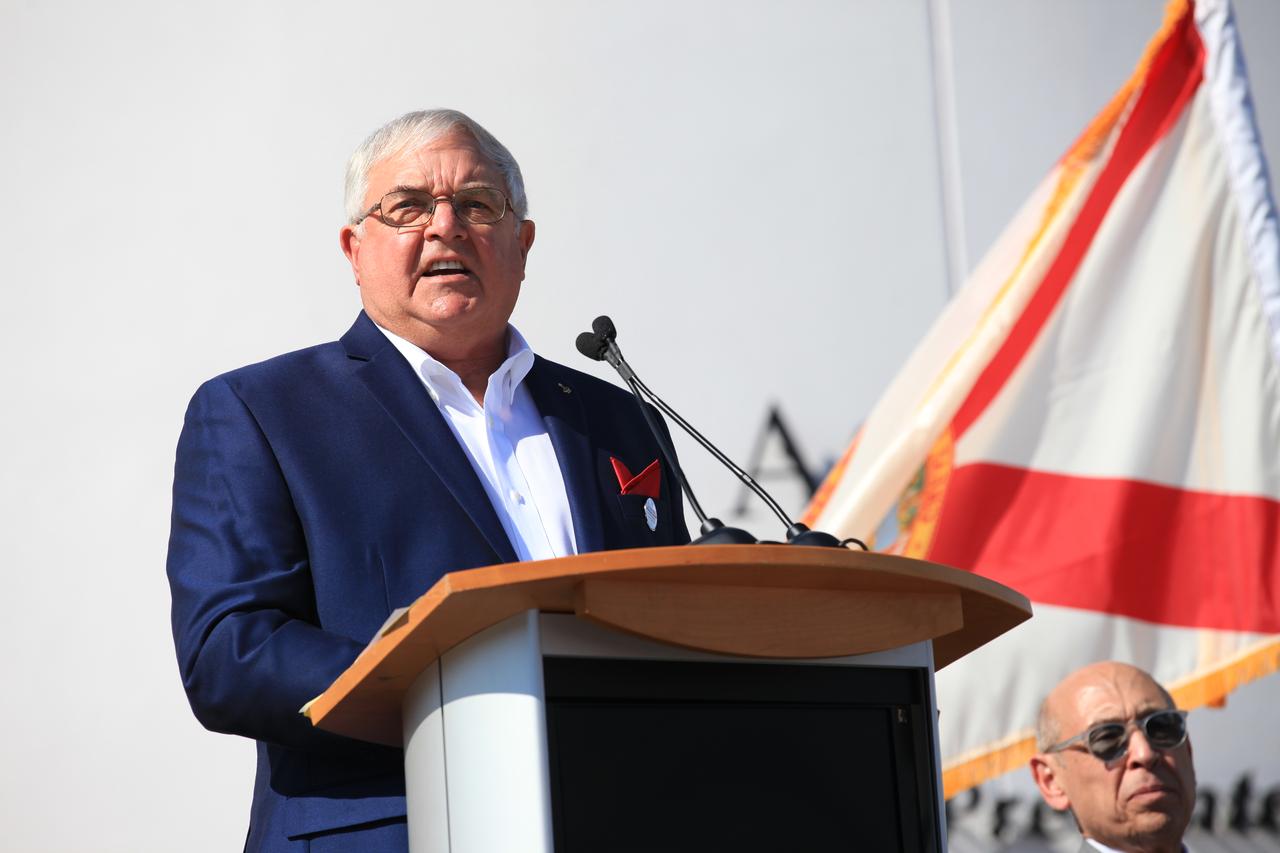 Former space shuttle astronaut Dan Brandenstein, chairman of the Astronaut Scholarship Foundation board of directors, speaks to guests during the opening of the Heroes and Legends attraction at the Kennedy Space Center Visitor Complex. The new facility includes the U.S. Astronaut Hall of Fame and looks back to the pioneering efforts of Mercury, Gemini and Apollo. It sets the stage by providing the background and context for space exploration and the legendary men and women who pioneered the nation's journey into space.