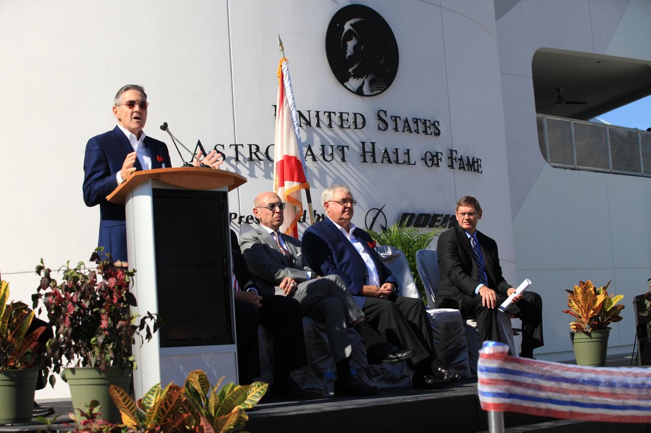 Kennedy Space Center Director Bob Cabana, a former space shuttle astronaut and member of the Astronaut Hall of Fame, speaks to guests during the opening of the Heroes and Legends attraction at the Kennedy Space Center Visitor Complex. Seated, from the left, are Rick Abramson, executive vice president and chief operating officer of Delaware North, former space shuttle astronaut Dan Brandenstein, chairman of the Astronaut Scholarship Foundation board of directors, and John Elbon, vice president and general manager of Boeing. The new facility includes the U.S. Astronaut Hall of Fame and looks back to the pioneering efforts of Mercury, Gemini and Apollo. It sets the stage by providing the background and context for space exploration and the legendary men and women who pioneered the nation's journey into space.