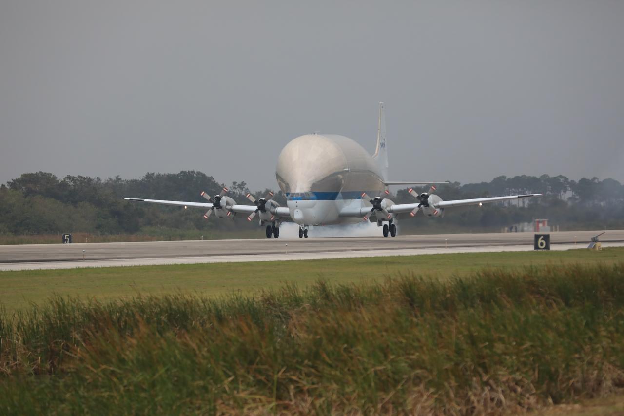 NASA’s Super Guppy aircraft touches down at the Shuttle Landing Facility at the agency’s Kennedy Space Center in Florida, carrying the Orion crew module structural test article (STA). The STA will be offloaded and transported to the Neil Armstrong Operations and Checkout Building high bay for further testing. Photo credit: NASA/Kim Shiflett