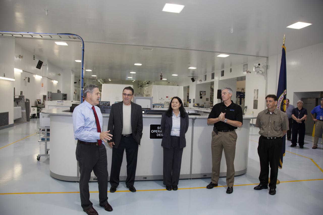 During a ribbon cutting ceremony in the high bay of the Space Station Processing Facility at NASA's Kennedy Space Center in Florida, center director Bob Cabana, far left, is joined by Bill Dowdell, Kennedy's International Space Station technical director, Josephine Burnett, director of Exploration Research and Technology, Andy Allen, Jacobs vice president and general manager and Test and Operations Support Contract program manager, and Jeff McAlear, Jacobs director of Processing Services. The event celebrated completion of facility modifications to improve processing and free up zones tailored to a variety of needs supporting a robust assortment of space-bound hardware including NASA programs and commercial space companies.