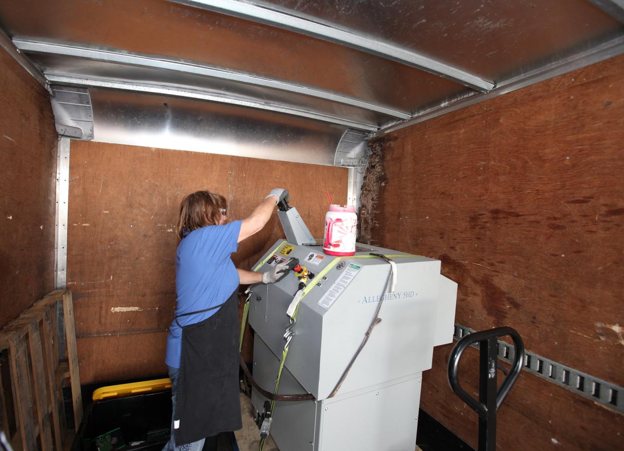 Members of the Sustainability team at NASA's Kennedy Space Center in Florida shred a disposed hard drive in conjunction with America Recycles Day.  America Recycles Day is a nationally recognized initiative dedicated to promoting recycling in the United States. Kennedy partnered with several organizations in order to donate as many of the items as possible to those who could use them the most in the Space Coast community. Space center personnel brought in electronic waste, gently used household goods, clothing and more.