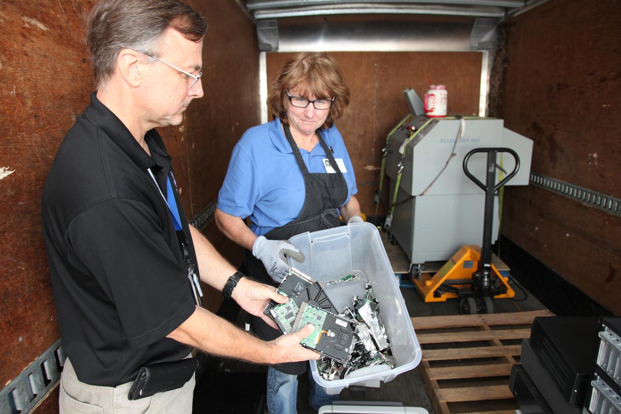 Members of the Sustainability team at NASA's Kennedy Space Center in Florida take a bin of disposed hard drives to be shredded in conjunction with America Recycles Day.  America Recycles Day is a nationally recognized initiative dedicated to promoting recycling in the United States. Kennedy partnered with several organizations in order to donate as many of the items as possible to those who could use them the most in the Space Coast community. Space center personnel brought in electronic waste, gently used household goods, clothing and more.