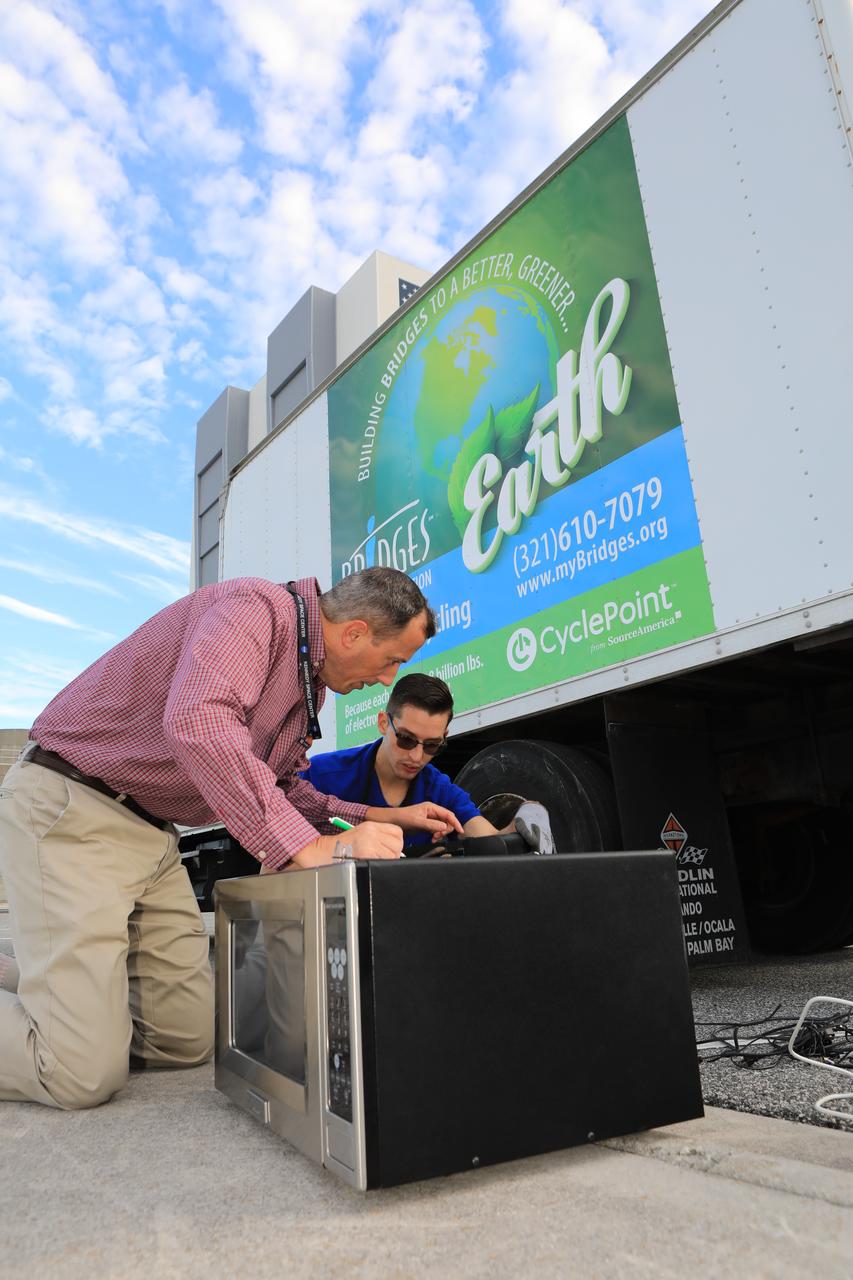 Members of the Sustainability team at NASA's Kennedy Space Center in Florida look over appliances donated for reuse or recycling in conjunction with America Recycles Day.  America Recycles Day is a nationally recognized initiative dedicated to promoting recycling in the United States. Kennedy partnered with several organizations in order to donate as many of the items as possible to those who could use them the most in the Space Coast community. Space center personnel brought in electronic waste, gently used household goods, clothing and more.
