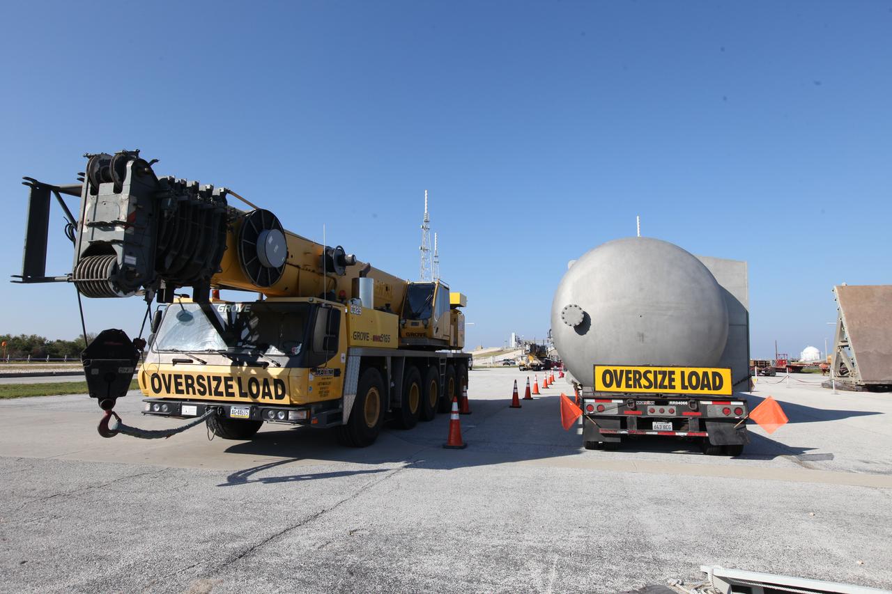 A new liquid hydrogen separator tank arrives at NASA's Kennedy Space Center in Florida. A crane will be used to lift and rotate the tank for delivery to Launch Pad 39B. The new separator/storage tank will be added to the pad's existing hydrogen vent system to assure gaseous hydrogen is delivered downstream to the flare stack. The 60,000 gallon tank was built by INOXCVA, in Baytown, Texas, a subcontractor of Precision Mechanical Inc. in Cocoa Florida. The new tank will support all future launches from the pad.