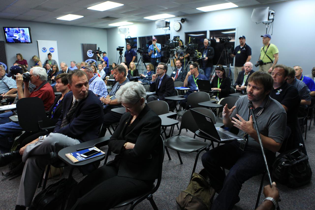 Members of the news media attend a Geostationary Operational Environmental Satellite (GOES-R) prelaunch news conference in the Kennedy Space Center's Press Site auditorium in Florida. NASA and industry leaders include: Michael Curie, of NASA Communications; Stephen Volz, assistant administrator for satellite and information services, National Oceanic and Atmospheric Administration (NOAA's); Greg Mandt, GOES-R system program director, NOAA; Sandra Smalley, director, Joint Agency Satellite Division, NASA Headquarters; Omar Baez, launch director, NASA Kennedy; Scott Messer, program manager, NASA Missions, United Launch Alliance; and Clay Flinn, launch weather officer, 4th Weather Squadron, Cape Canaveral Air Force Station. 