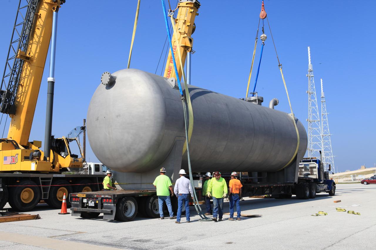 A new liquid hydrogen separator tank arrives at NASA's Kennedy Space Center in Florida. The tank has been lifted and rotated by crane and lowered back onto the flatbed truck for transport to Launch Pad 39B. The new separator/storage tank will be added to the pad's existing hydrogen vent system to assure gaseous hydrogen is delivered downstream to the flare stack. The 60,000 gallon tank was built by INOXCVA, in Baytown, Texas, a subcontractor of Precision Mechanical Inc. in Cocoa Florida. The new tank will support all future launches from the pad.