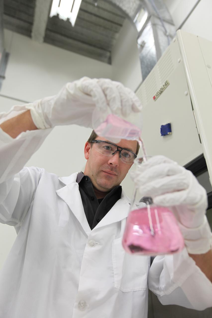 Dr. Luke Roberson, NASA scientist in the Exploration Research and Technology Programs, works in a laboratory in the Space Station Processing Facility at NASA's Kennedy Space Center in Florida.
