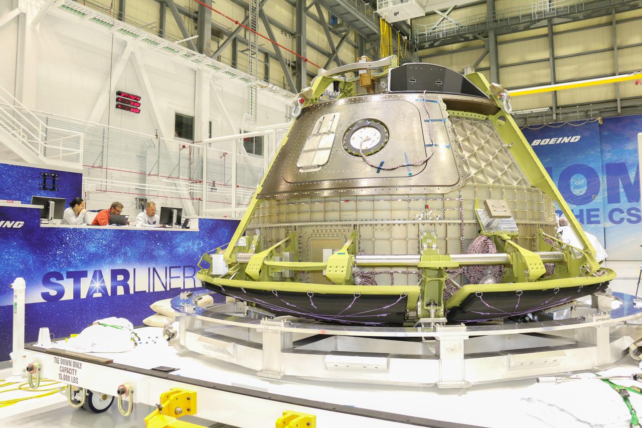 Boeing’s Structural Test Article of its CST-100 Starliner spacecraft is readied inside the company’s Commercial Crew and Cargo Processing Facility at NASA’s Kennedy Space Center. Built to the specifications of an operational spacecraft, the STA is intended to be evaluated through a series of thorough testing conditions at facilities in Huntington Beach, California.