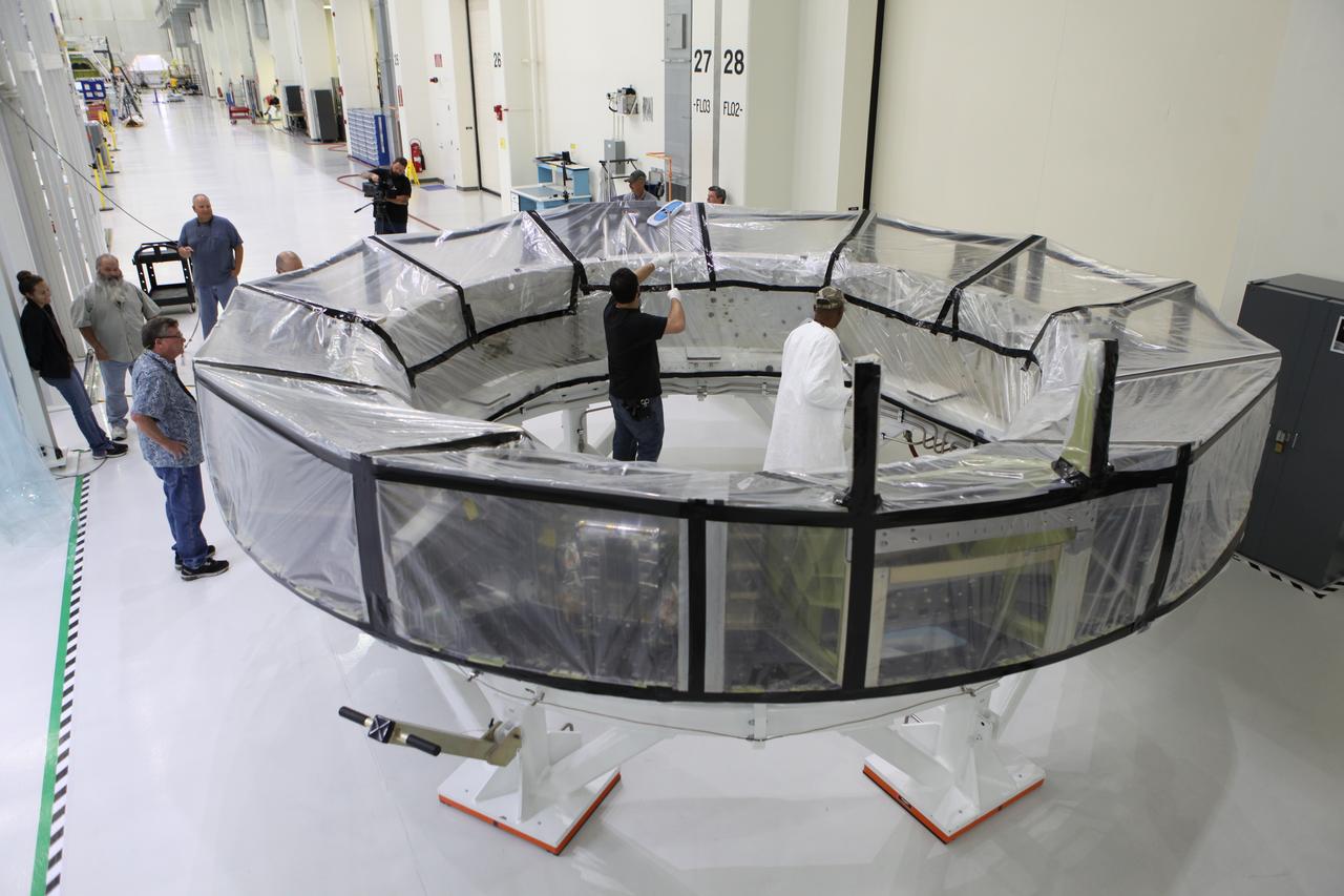 Inside the Neil Armstrong Operations and Checkout Building high bay at NASA’s Kennedy Space Center in Florida, Lockheed Martin technicians are preparing the Orion crew module adapter (CMA) for Exploration Mission 1 (EM-1) for the move into a clean room. The CMA will undergo propellant and environmental control and life support system tube installation and welding. The adapter will connect the Orion crew module to the European Space Agency-provided service module. The Orion spacecraft will launch atop NASA’s Space Launch System rocket on EM-1, its first deep space mission, in late 2018.