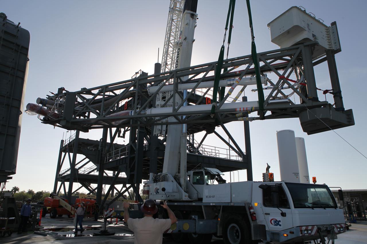 A crane is used to lift the Core State Inter-tank Umbilical (CSITU) for NASA's Space Launch System (SLS) at the Launch Equipment Test Facility at the agency's Kennedy Space Center in Florida. The CSITU will be attached to the "C" tower of the Vehicle Motion Simulator 2 test fixture. The umbilical will undergo a series of tests to confirm it is functioning properly and ready to support the SLS rocket for launch. The CSITU is a swing arm umbilical that will connect to the SLS core stage inter-tank. The umbilical's main function is to vent gaseous hydrogen from the core stage. The arm also provides conditioned air, pressurized gases, and power and data connection to the core stage. The center’s Engineering Directorate and the Ground Systems Development and Operations Program are overseeing processing and testing of the umbilicals.