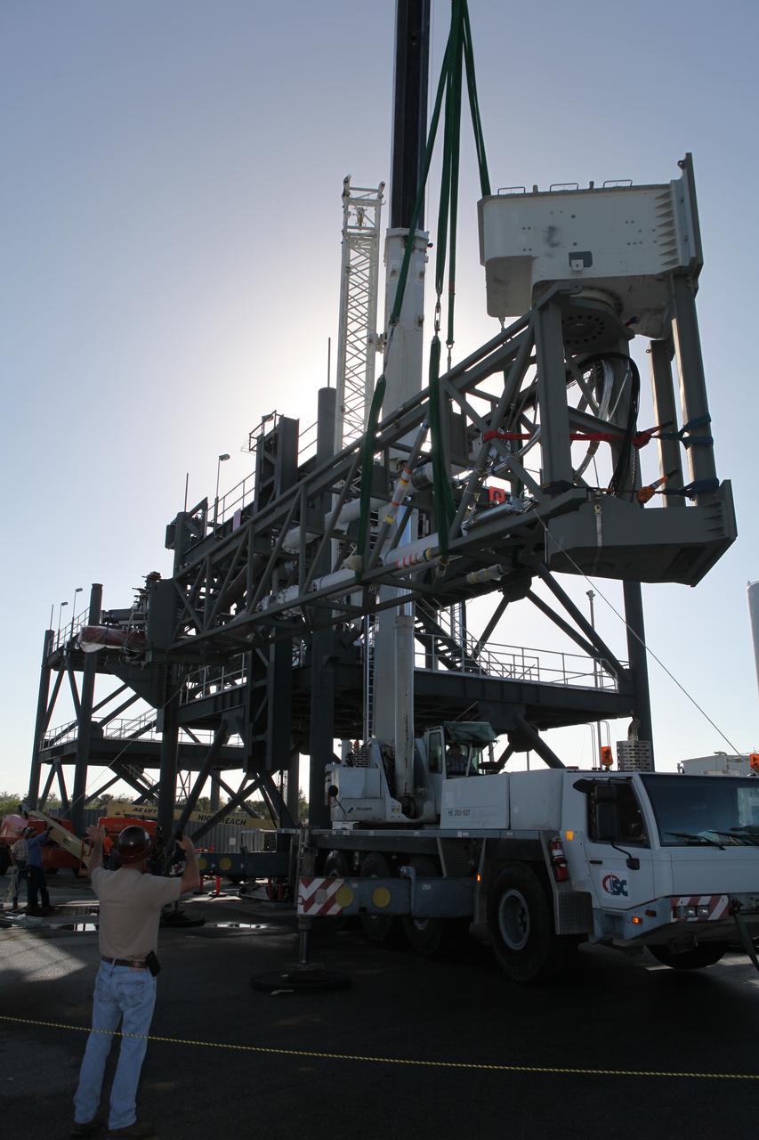 A crane is used to lift the Core State Inter-tank Umbilical (CSITU) for NASA's Space Launch System (SLS) at the Launch Equipment Test Facility at the agency's Kennedy Space Center in Florida. The CSITU will be attached to the "C" tower of the Vehicle Motion Simulator 2 test fixture. The umbilical will undergo a series of tests to confirm it is functioning properly and ready to support the SLS rocket for launch. The CSITU is a swing arm umbilical that will connect to the SLS core stage inter-tank. The umbilical's main function is to vent gaseous hydrogen from the core stage. The arm also provides conditioned air, pressurized gases, and power and data connection to the core stage. The center’s Engineering Directorate and the Ground Systems Development and Operations Program are overseeing processing and testing of the umbilicals. 