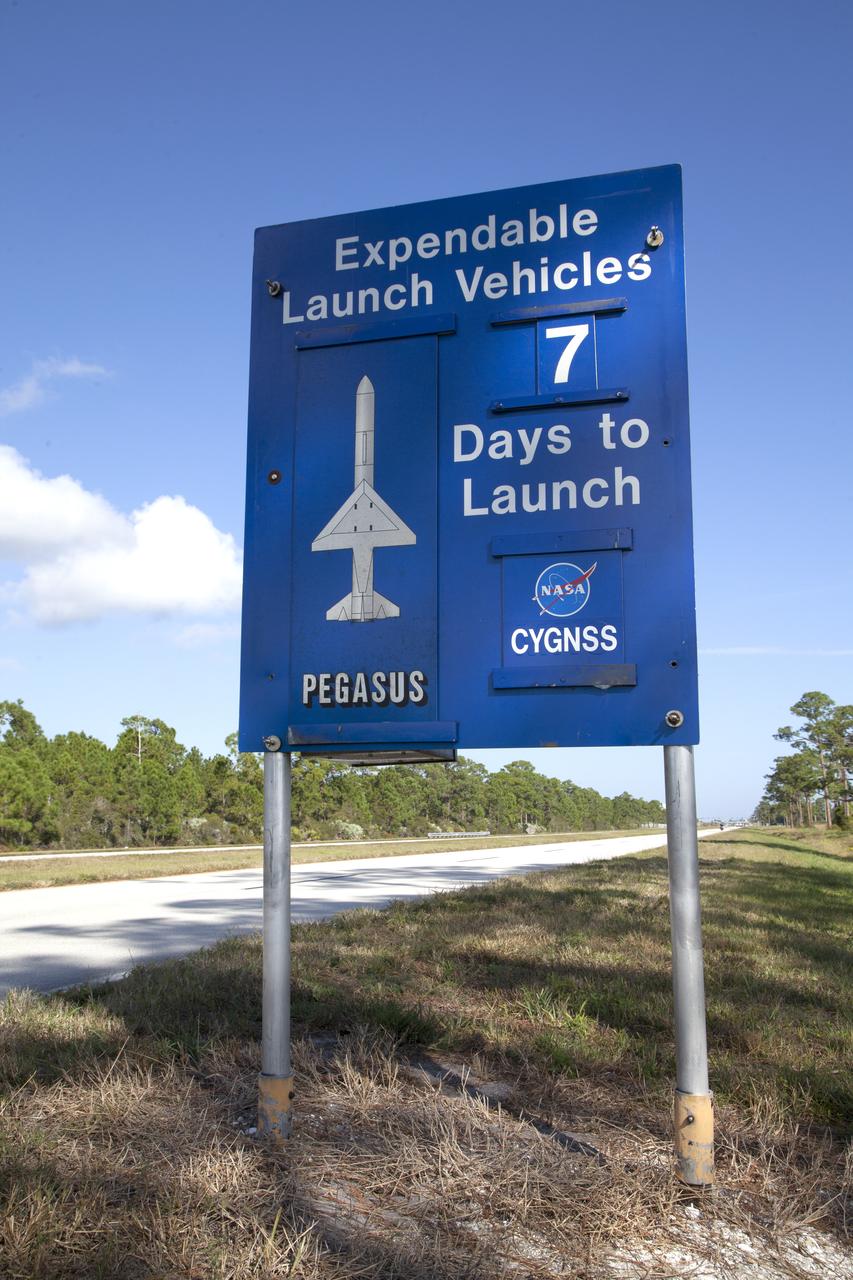 A sign just inside the gate to NASA's Kennedy Space Center in Florida notes that in seven days a Pegasus XL rocket is scheduled to launch with eight agency Cyclone Global Navigation Satellite System, or CYGNSS, spacecraft. On Dec. 12, 2016, the Orbital ATK L-1011 Stargazer, with a Pegasus XL rocket mated to the underside of the aircraft, will take off from the Skid Strip at Cape Canaveral Air Force Station. CYGNSS will launch on the Pegasus XL rocket with the L-1011 flying off shore. CYGNSS satellites will make frequent and accurate measurements of ocean surface winds throughout the life cycle of tropical storms and hurricanes. The data that CYGNSS provides will help scientists to probe key air-sea interaction processes that take place near the core of storms, which are rapidly changing and play a crucial role in the beginning and intensification of hurricanes.