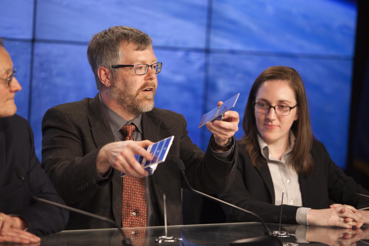 In the Kennedy Space Center’s Press Site auditorium, NASA and industry leaders speak to members of the media during a mission science briefing for the agency’s Cyclone Global Navigation Satellite System, or CYGNSS, spacecraft. From left are: Dr. Chris Ruf, CYGNSS principal investigator, Department of Climate and Space Sciences and Engineering at the University of Michigan; Aaron Ridley, CYGNSS constellation scientist in the Climate and Space Department at the University of Michigan in Ann Arbor, Michigan; and Mary Morris, doctoral student in the Department of Climate and Space Sciences and Engineering at the University of Michigan. The eight CYGNSS satellites will make frequent and accurate measurements of ocean surface winds throughout the life cycle of tropical storms and hurricanes. The data will help scientists probe key air-sea interaction processes that take place near the core of storms, which are rapidly changing and play a crucial role in the beginning and intensification of hurricanes.