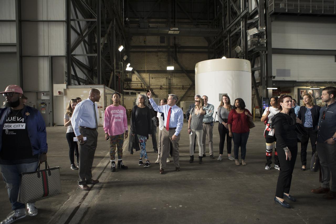 Kennedy Space Center Director Bob Cabana (center pointing to the left) provides a tour for cast and crew members of the upcoming motion picture "Hidden Figures." The group is walking thought the transfer aisle of the Vehicle Assembly Building. The movie is based on the book of the same title, by Margot Lee Shetterly. It chronicles the lives of Katherine Johnson, Dorothy Vaughan and Mary Jackson, three African-American women who worked for NASA as human "computers.” Their mathematical calculations were crucial to the success of Project Mercury missions including John Glenn’s orbital flight aboard Friendship 7 in 1962. The film is due in theaters in January 2017.