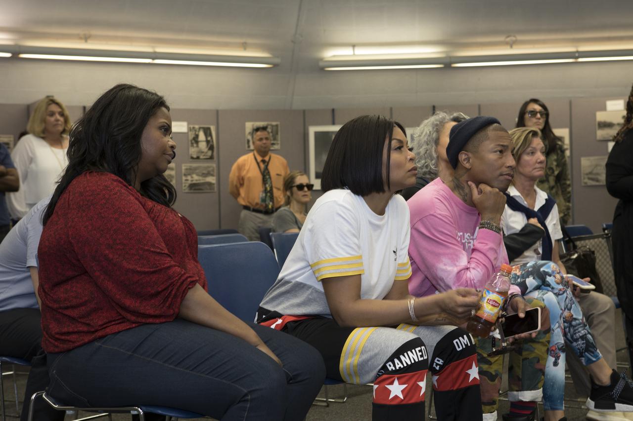 In the blockhouse at Cape Canaveral Air Force Station's Launch Pad 14, cast and crew members of the upcoming motion picture "Hidden Figures" listen to a briefing on the pad which was the location of the launch of John Glenn and three other astronauts who flew orbital missions during Project Mercury. In the foreground, from the left, are Octavia Spencer, who portrays Dorothy Vaughan, Taraji P. Henson, who portrays Katherine Johnson in the film, Janelle Monáe, who portrays Mary Jackson, and Pharrell Williams, musician and producer of “Hidden Figures." The movie is based on the book of the same title, by Margot Lee Shetterly. It chronicles the lives of Katherine Johnson, Dorothy Vaughan and Mary Jackson, three African-American women who worked for NASA as human "computers.” Their mathematical calculations were crucial to the success of Project Mercury missions including Glenn’s orbital flight aboard Friendship 7 in 1962. The film is due in theaters in January 2017.