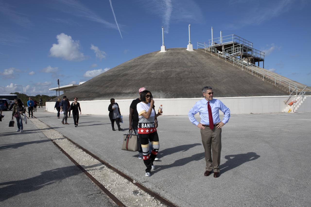 Kennedy Space Center Director Bob Cabana, right, provides a tour for cast and crew members of the upcoming motion picture "Hidden Figures." The group is near the blockhouse at Launch Pad 14 at Cape Canaveral Air Force Station. The pad which was the location of the launch of John Glenn and three other astronauts who flew orbital missions during Project Mercury. To Cabana's right is Taraji P. Henson, who portrays Katherine Johnson in the film. The movie is based on the book of the same title, by Margot Lee Shetterly. It chronicles the lives of Katherine Johnson, Dorothy Vaughan and Mary Jackson, three African-American women who worked for NASA as human "computers.” Their mathematical calculations were crucial to the success of Project Mercury missions including Glenn’s orbital flight aboard Friendship 7 in 1962. The film is due in theaters in January 2017.