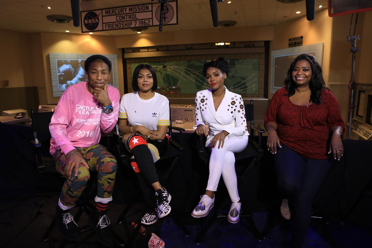 Cast and crew members of the upcoming motion picture "Hidden Figures" participate in a question and answer session at the Kennedy Space Center Visitor Complex. From the left are Pharrell Williams, musician and producer of “Hidden Figures," Taraji P. Henson, who portrays Katherine Johnson in the film, Janelle Monáe, who portrays Mary Jackson, and Octavia Spencer, who portrays Dorothy Vaughan. They are seated in front of the original consoles of the Mercury Mission Control room with the world map that was used to follow the path of capsules between tracking stations. The movie is based on the book of the same title, by Margot Lee Shetterly. It chronicles the lives of Katherine Johnson, Dorothy Vaughan and Mary Jackson, three African-American women who worked for NASA as human "computers.” Their mathematical calculations were crucial to the success of Project Mercury missions including John Glenn’s orbital flight aboard Friendship 7 in 1962. The film is due in theaters in January 2017.