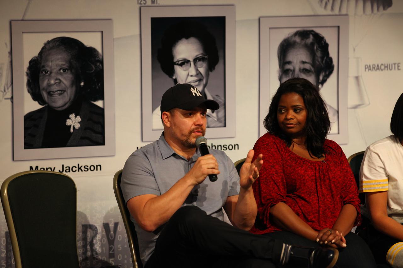 In the IMAX Theater of the Kennedy Space Center Visitor Complex Cast and crew members of the upcoming motion picture "Hidden Figures" participate in a question and answer session. From the left are Ted Melfi, writer and director of “Hidden Figures,” and Octavia Spencer, who portrays Dorothy Vaughan in the film. The movie is based on the book of the same title, by Margot Lee Shetterly. It chronicles the lives of Katherine Johnson, Dorothy Vaughan and Mary Jackson, three African-American women who worked for NASA as human "computers.” Their mathematical calculations were crucial to the success of Project Mercury missions including John Glenn’s orbital flight aboard Friendship 7 in 1962. The film is due in theaters in January 2017.