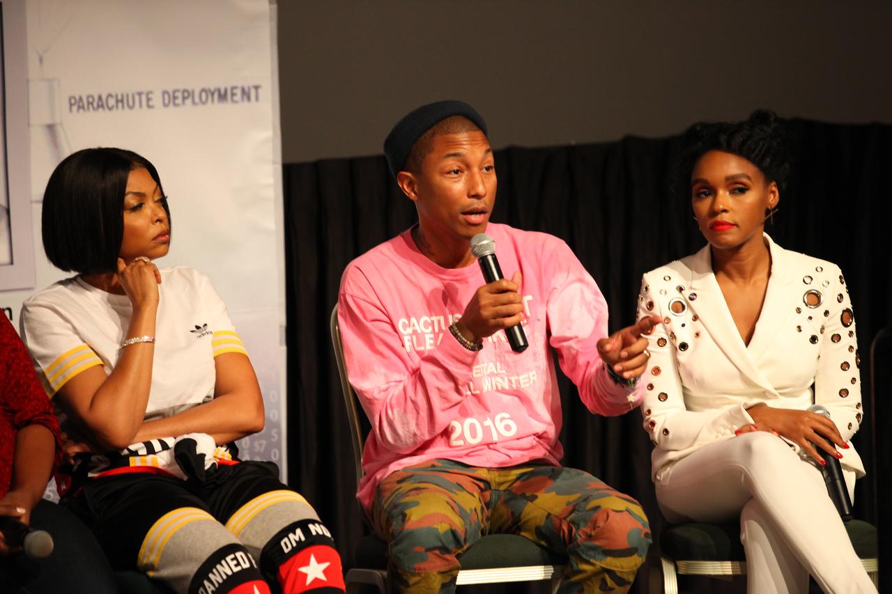 In the IMAX Theater of the Kennedy Space Center Visitor Complex Cast and crew members of the upcoming motion picture "Hidden Figures" participate in a question and answer session. From the left are Taraji P. Henson, who portrays Katherine Johnson in the film, Pharrell Williams, musician and producer of “Hidden Figures," and Janelle Monáe, who portrays Mary Jackson. The movie chronicles the lives of Katherine Johnson, Dorothy Vaughan and Mary Jackson, three African-American women who worked for NASA as human "computers.” Their mathematical calculations were crucial to the success of Project Mercury missions including John Glenn’s orbital flight aboard Friendship 7 in 1962. The film is due in theaters in January 2017.